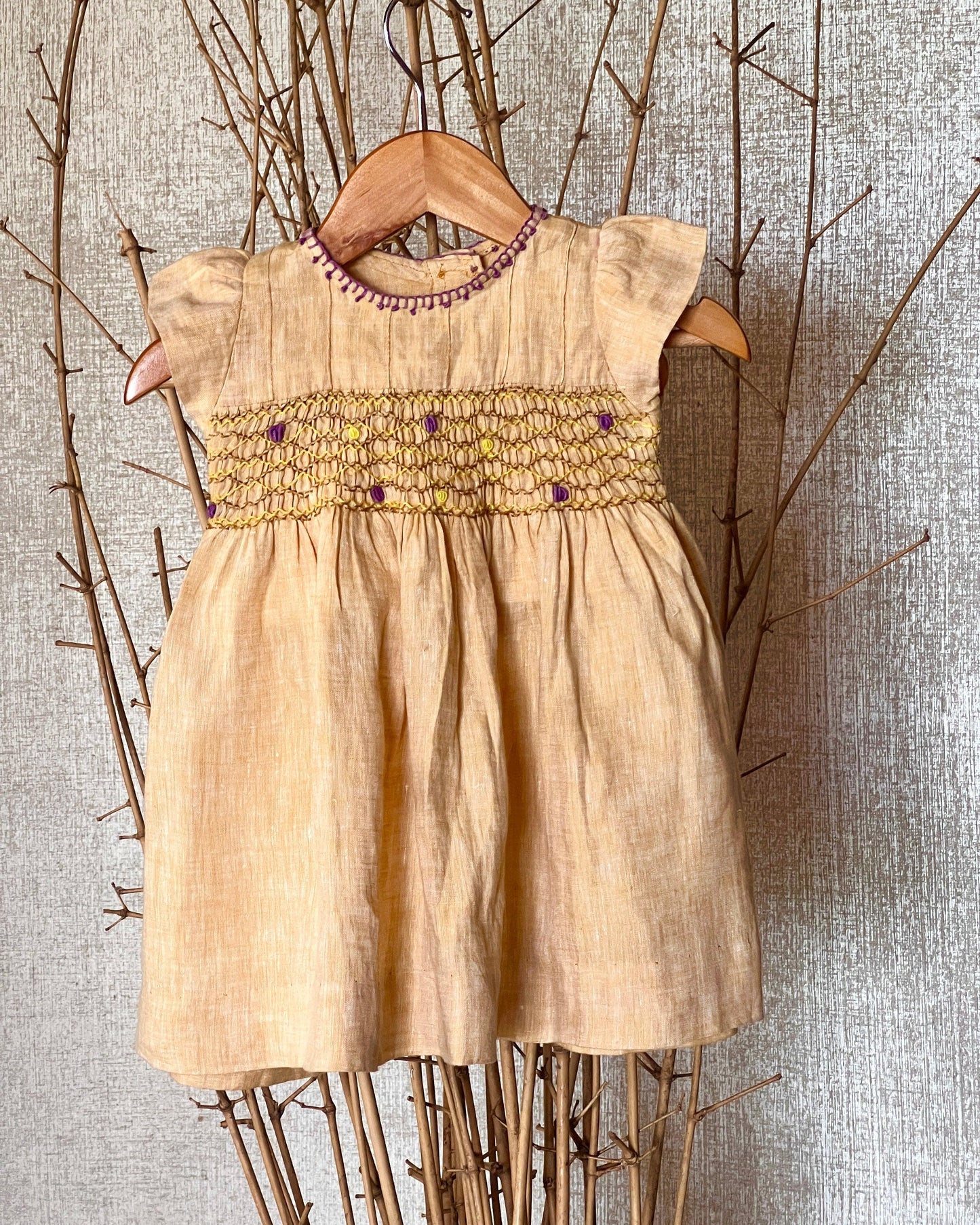 Pure linen smocked dress for girls with hand embroidery, flutter sleeves, and a soft breathable fabric—perfect for warm days and special occasions.
