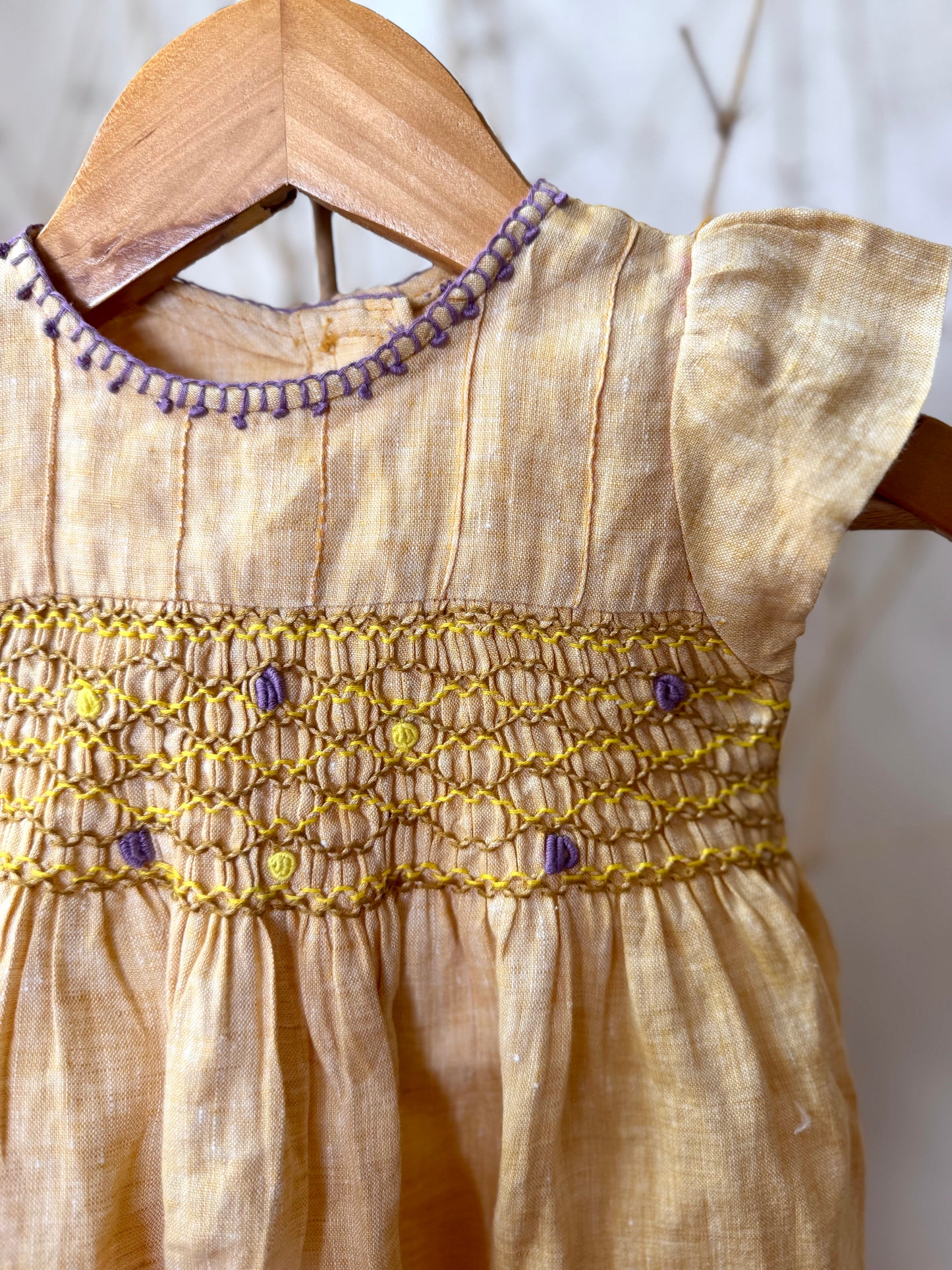 Pure linen smocked dress for girls with hand embroidery, flutter sleeves, and a soft breathable fabric—perfect for warm days and special occasions.