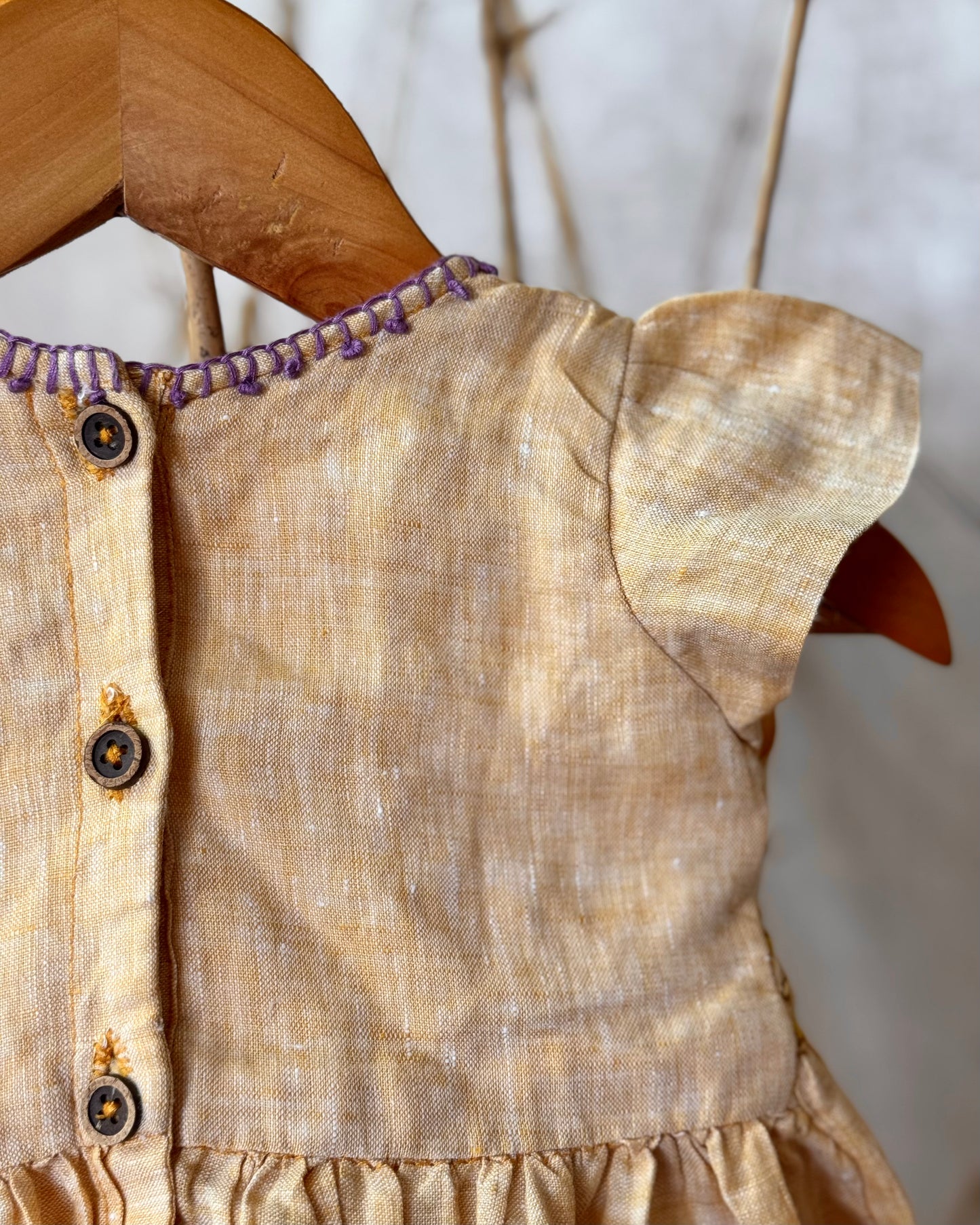 Pure linen smocked dress for girls with hand embroidery, flutter sleeves, and a soft breathable fabric—perfect for warm days and special occasions.